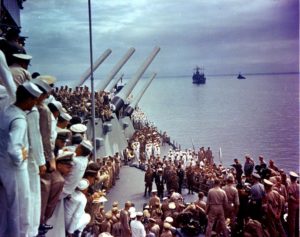 Signing of the Japanese surrender on board USS Missouri, 2 September 1945. Photo by U.S. Navy (1945). PD-US Government image. Wikimedia Commons.