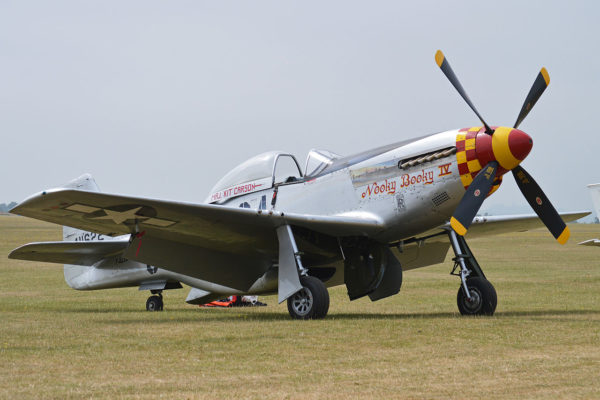 This Mustang is painted to represent “Nooky Booky IV” flown by Major “Kit” Carson of the 362nd Fighter Squadron, 357th Fighter Group based at Leiston in Suffolk. Photo by Alan Wilson (2013). PD-Author’s release. Wikimedia Commons.