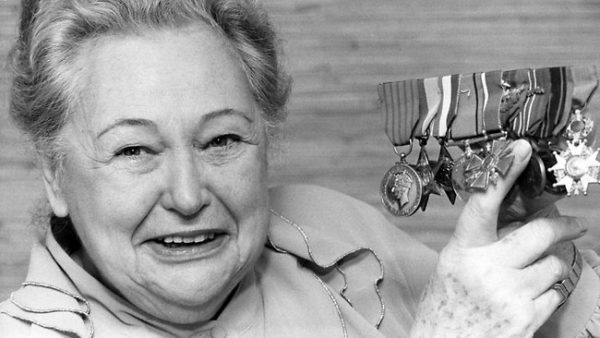 Nancy Wake – The White Mouse shows off her medals. Photo by anonymous (c. 1994). Courier Mail—Wikimedia.