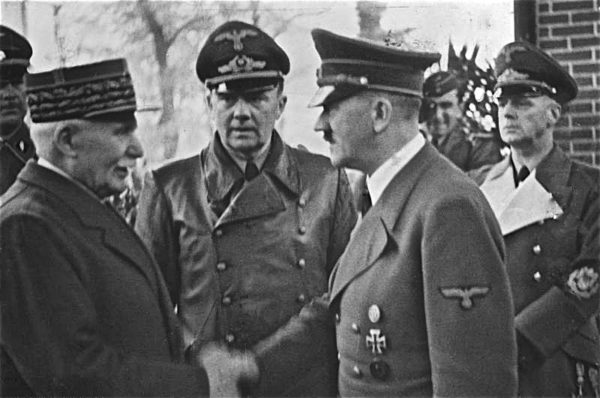 Marshal Pétain meeting Adolf Hitler. Translator in center and von Ribbentrop on the right. Photo by Heinrich Hoffmann (24 October 1940). Bundesarchiv, Bild 183-H25217/CC-BY-SA 3.0. Wikimedia Commons. 