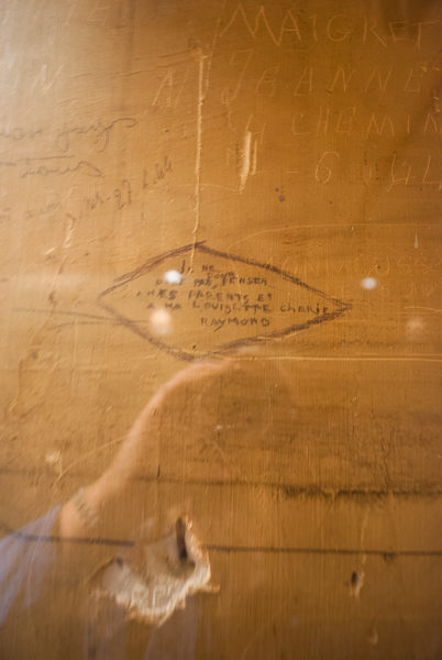 Prisoner’s graffiti from the interior of the holding cell at the former headquarters of the Gestapo. Photo by Sandy Ross.
