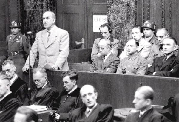 Trial of the SS Economic and Administrative Main Office (Case 4): Defendant Oswald Pohl indicted on three counts of war crimes including running a concentration camp. Oswald was found guilty and hanged. Photo by US Army (22 September 1947). PD-US Government. Wikimedia Commons. 