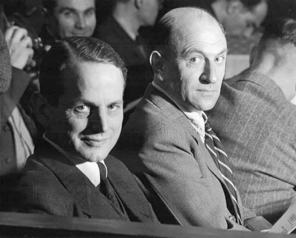 Defendants Otto Ohlendorf (left) and Heinz Jost (right) in the dock for the Einsatzgruppen Trial (Case 9). Accused of commanding Einsatzgruppen units for the purpose of exterminating Jews, Roma (gypsies), and other civilians in the Eastern territories. Both were found guilty: Ohlendorf was hanged and Jost given life sentence—released in 1951). Photo by US Army (9 February 1948). PD-US Government. Wikimedia Commons.