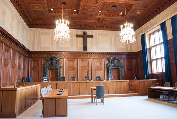 Interior view of Courtroom 600. Judges platform in 1945 would have been on the right--in front of the windows. Defendants dock was on the left facing the judges. Photo by Sandy Ross (2017).