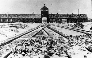 Entrance to Auschwitz II-Birkenau. Photo by Stanislaw Mucha (c. 1945). German Federal Archives. Bundesarchiv, B 285 Bild-04413/Stanislaw Mucha/CC-BY-SA 3.0. Wikimedia Commons. 