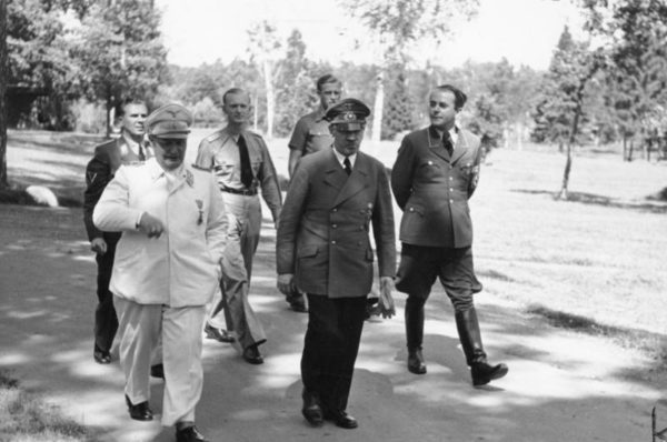 Hermann Göring (front left), Adolf Hitler (front center), and Albert Speer (front right). Photo by Heinrich Hoffmann (10 August 1943). Bundesarchiv, Bild 146-1977-149-13/Heinrich Hoffmann/CC-BY-SA 3.0. PD-Creative Commons Attribution-Share Alike 3.0 Germany. Wikimedia Commons. 