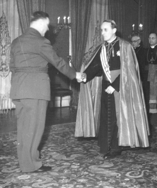 Ante Pavelić and Cardinal Alojzije Stepinac meeting in 1941. Photo by anonymous (c. 1941). PD-No restrictions. Wikimedia Commons. 