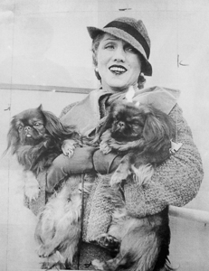Florence Lacaze Gould aboard the SS Normandie in 1935 with two of her Pekingese dogs. Photo by anonymous (c. 1935). Courtesy of the Library of Congress. 