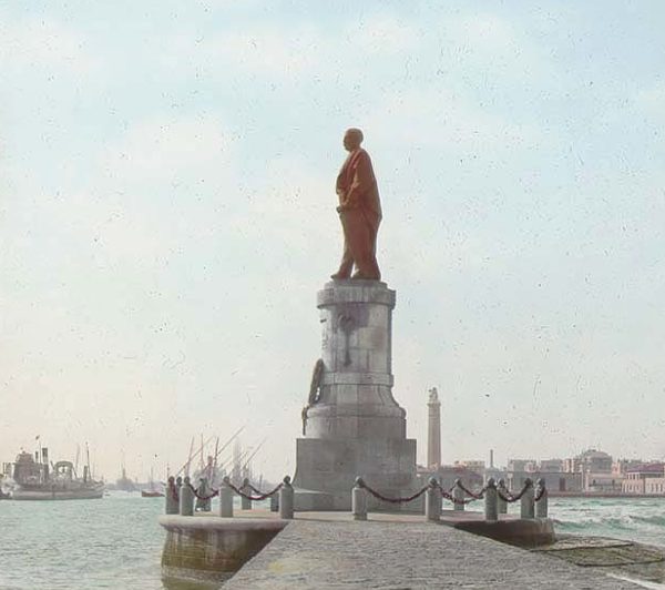 Statue of Ferdinand de Lesseps and view of city (Port Said) in the background. Photo by anonymous (c. 1906). The Field Museum Library. PD-No known copyright restrictions. Wikimedia Commons. 