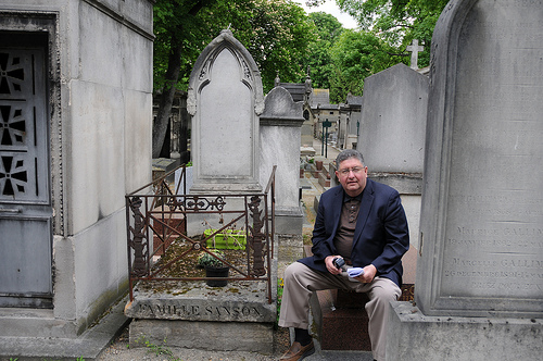 Stew sitting next to the Sanson Family grave in Montmartre Cemetery. They were six generations of French executioners. Photo by Dan Owen (2013). 