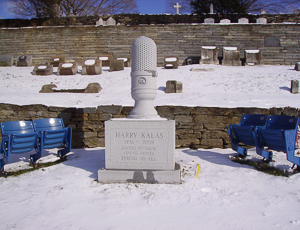 Harry Kalas grave marker. Harry (1936-2009) was the play-by-play announcer for the Philidelphia Phillies. On either side are two pairs of seats from Veterans Stadium. Photo by OldsVistaCruiser (2011). PD-CCA-Share Alike 3.0 Unported. Wikimedia Commons. 