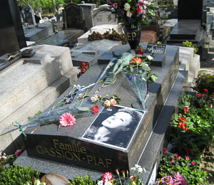Grave of Edith Piaf. Photo by Prewitt8 (2008). Père Lachaise Cemetery. PD-GNU Free Documentation License. Wikimedia Commons. 