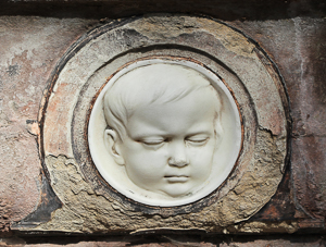 Tomb of Dantan with portrait of deceased child. Sculpture by anonymous (date unknown). Photo by Coyau (2012). Père Lachaise Cemetery. PD-GNU Free Documentation. Wikimedia Commons. 
