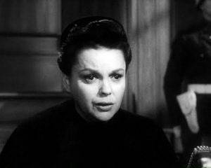 Judy Garland portraying the character of Irene Hoffman based on Irene Seiler. Screenshot from trailer for the film, Judgement at Nuremberg (1961). PD-No Copyright Notice. Wikimedia Commons. 