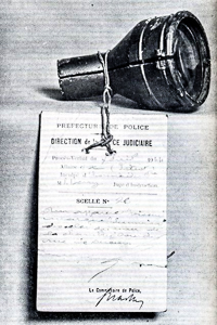 Telescope viewing lens (marked as evidence) used by Petiot to watch his victims die inside the death chamber. Photo by anonymous (date unknown).