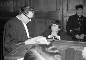 Mathilde Carré conferring with her trial attorney. Photo by anonymous (January 1949). 