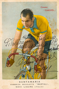 Collector’s card of Gino Bartali and signed by Bartali. Photo by anonymous (c. 1940). Museo Ciclismo. PD-Expired Copyright. Wikimedia Commons. 