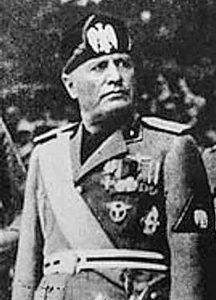 Benito Mussolini during an official visit to occupied Yugoslavia. Photo by anonymous (c. 1941−1943). Muzej Revolucije Narodnosti Jugoslavije. PD-Author Released. Wikimedia Commons. 