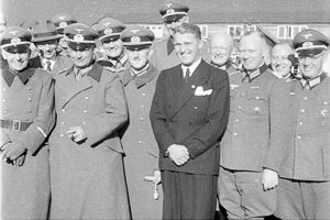 Peenemünde: Dr. Walter Dornberger on the far left (in his SS uniform), Dr. Wernher von Braun in dark business suit. Photo by anonymous (21 March 1941). Bundesarchiv, Bild 146-1978-AnH.030-02/CC-BY-SA 3.0. PD-CCA-Share Alike 3.0 Germany. Wikimedia Commons. 