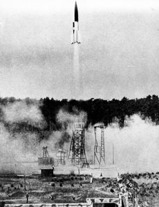 Launch of a V-2 rocket. Photo by anonymous (Summer 1943). Bundesarchiv, Bild 141-1880/CC-BY-SA 3.0. PD-CCA-Share Alike 3.0 Germany. Wikimedia Commons. 