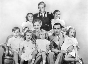 Joseph and Magda Goebbels with their six children. Harald Quandt is in uniform as a Luftwaffe officer. Photo by anonymous (1 January 1944). PD-Bundesarchiv, Bild 146-1978-086-03/CC-BY-SA 3.0. Wikimedia Commons. 
