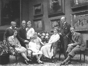 The Krupp Family: Gustav (second from right) and Alfried (third from the left). Photo by Nicola Perscheid (c. 1928). PD-70+. Wikimedia Commons. 