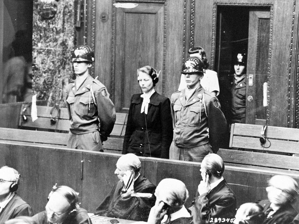 Defendant Herta Oberheuser stands up to receive her sentencing at the Doctors’ Trial, Nuremberg 1947. Photo by anonymous (20 August 1947). National Archives and Records Administration. PD-U.S. Government. Wikimedia Commons.