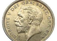 British coin with King George V (son of King Edward VII) facing left. Photo by anonymous (date unknown).