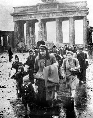 German civilians marching through war-torn Berlin after the war ended. Photo by anonymous (c. 1945).