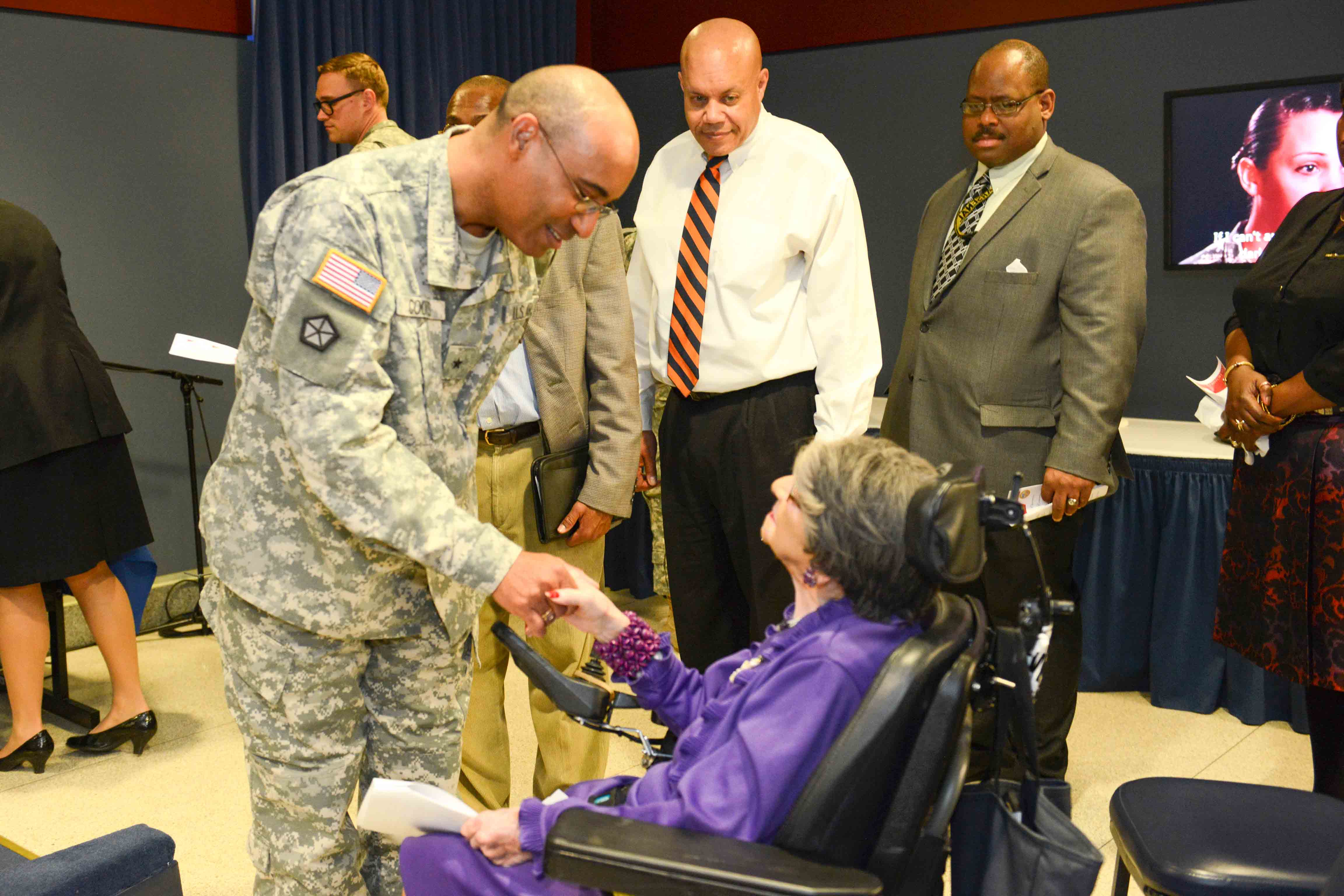 Brig. Gen. Norvell Coots greets World War II Army veteran, 106-year-old Alyce Dixon, after she was honored at the Pentagon. Photo by Lisa Ferdinando (31 March 2014). PD-U.S. Government. Wikimedia Commons.