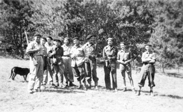 Maquisards (resistance fighters) in the Haute-Savoie département. SOE agents are third and fourth from the right. Photo by U.K. Government (August 1944). PD-U.K. Government. Wikimedia Commons.
