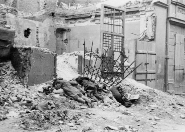 Bandits destroyed in battle (original title). The bodies of Jews executed after being captured. Photo by Franz Konrad or Propaganda Kompanie nr 689 (c. April/May 1943). The Stroop Report. U.S. National Archives and Records Administration and Polish Institute of National Remembrance. PD-Expired Copyright. Wikimedia Commons.