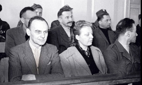 Witold Pilecki (first row, left) sitting in the defendant’s box during his “show” trial. Photo by anonymous (c. March 1948). Institute of National Remembrance Archive. PD- Polish Copyright Law Act. Wikimedia Commons.