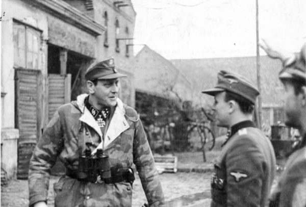 SS-Oberstürmbannführer Otto Skorzeny (left). Image taken around the time Skorzeny was training Werwolf recruits. Photo by anonymous (February 1945). Bundesarchiv, Bild 183-R81453/CC-BY-SA 3.0. PD-CCA-Share Alike 3.0 Germany. Wikimedia Commons.