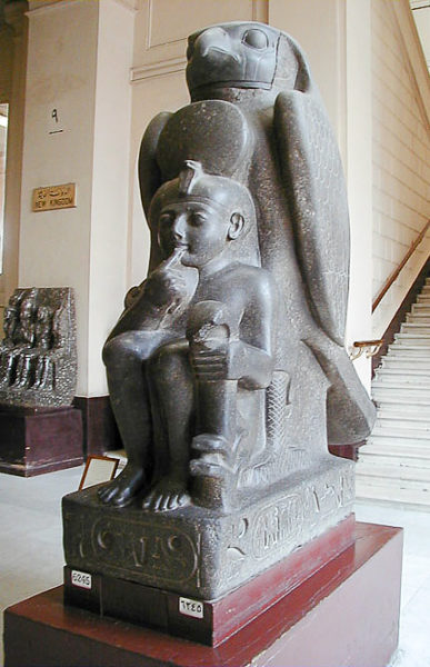 Statue of Ramses II as a child and the god Hwrwn (god of Canaan). Photo by Jon Bodsworth (2007). Cairo Egyptian Museum. PD-Author Release. Wikimedia Commons.