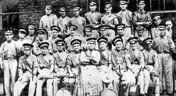 The flute band. Billy Fullerton is behind the drum with his arms crossed (center). Photo by anonymous (date unknown).