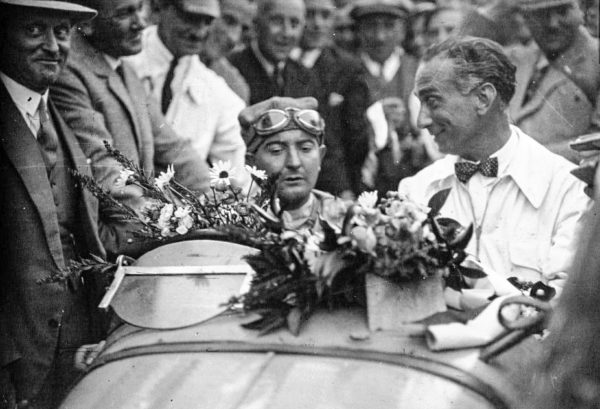 W. Williams in the victory circle after winning the 1931 Belgium Grand Prix. Photo by anonymous (1931). Bibliothèque nationale de France. PD-70+. Wikimedia Commons.