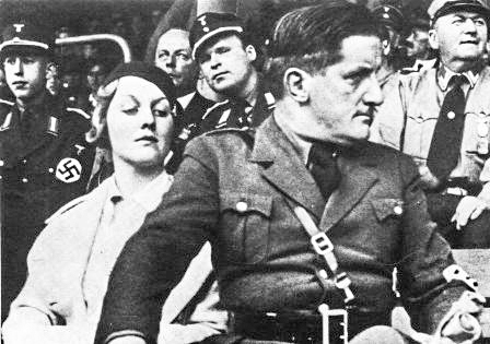 Ernst “Putzi” Hanfstaengl (center forefront), Hitler’s best friend and Diana Mitford (left) at the 1934 Nuremberg Nazi Party rally. Photo by anonymous (c. 1934). PD-70+. Wikimedia Commons.