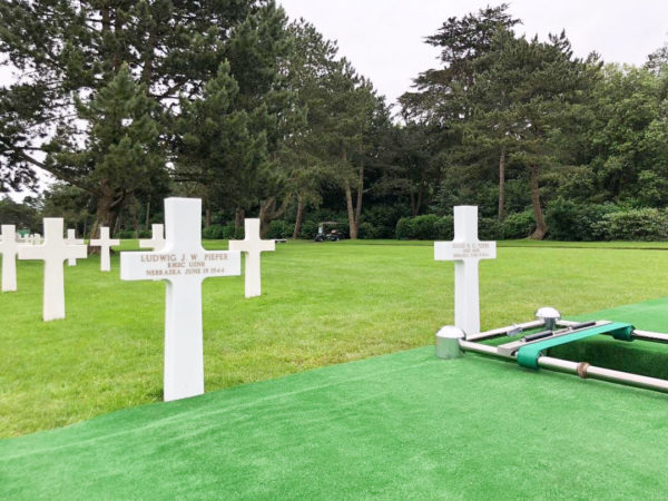 Headstones for Ludwig (left) and Julius (right) Pieper sit side-by-side at the American Cemetery overlooking Omaha Beach. Photo by Eleanor Beardsley/NPR (19 June 2018). 