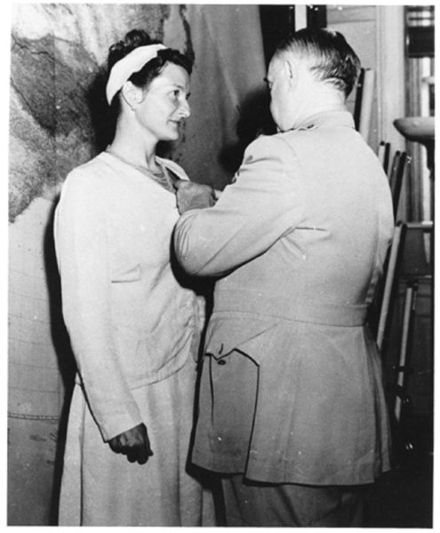 Virginia Hall (left) being decorated with the Distinguished Service Cross by "Wild Bill" Donovan (right) for her war efforts. Photo by anonymous (September 1945). PD-U.S. Government.