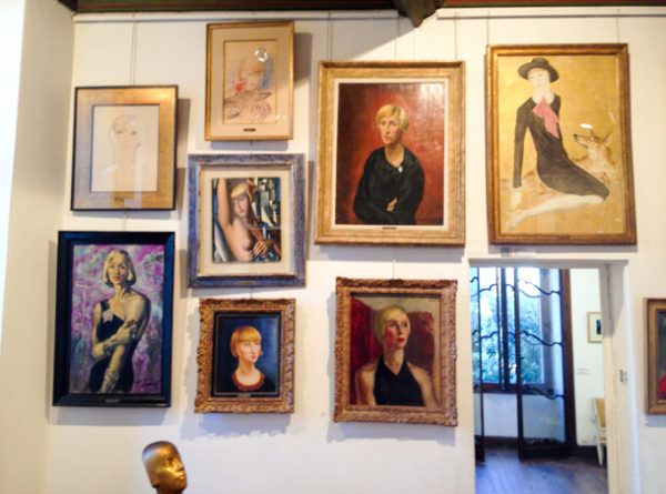 Collection of Suzy Solidor portraits hanging in “le Château-Musée Grimaldi.” Photo by anonymous (date unknown). 