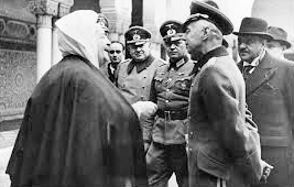 Benghabrit greeting German officers at the Great Mosque of Paris. Photo by anonymous (date unknown).