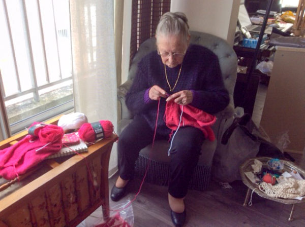 Lucy (Pilette) Spaak knitting. Photo by Linda Weber (c. 2015). Permission by Linda Weber.