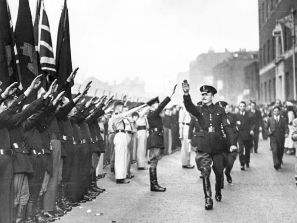 Oswald Mosley saluting the blackshirts of the British Union of Fascists. Photo by anonymous (date unknown).