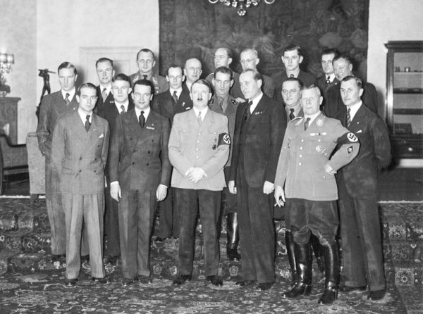 Front row, left to right: Bernd Rosemeyer (SS; 1909-1938), Rudi Caracciola (1901-1959), Hitler, Hans Stuck (1900-1978), Adolf Hühnlein (uniform; 1881-1942), Ernst Henne (1904-2005). Photo by anonymous (date unknown).