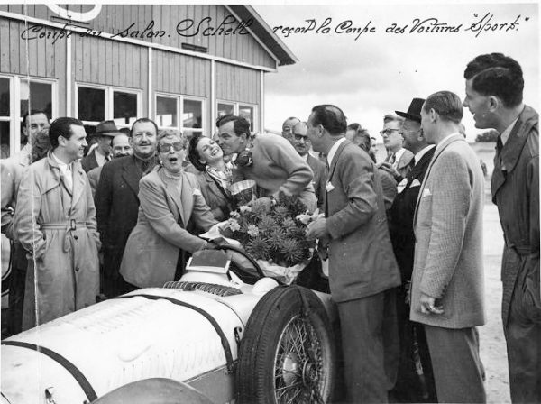 Harry Schell in the winner’s circle at Linas-Montlhéry. Lucy O’Reilly Schell is facing camera with her hands on the steering wheel. Photo by anonymous (9 October 1949). Adam Ferrington Collection.