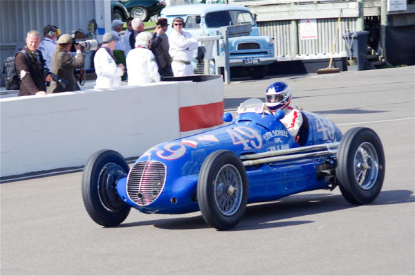 One of the two Maserati 8CTF owned by Écurie Bleue and Lucy O’Reilly Schell. This car was driven by René Le Begue in the 1940 Indy 500. Notice the owner’s name to the right of the number 49. Lucy’s emblem was the crossed flags of France and the United States. Photo by David Merrett (September 2012). PD-CCA 2.0 Generic. Wikimedia Commons. 