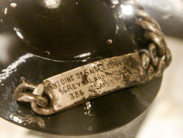 Antoine de Saint-Exupéry’s bracelet recovered in the Mediterranean Sea by a fisherman in 1998. Photo by Fredriga (2009). PD-Author Release. Wikimedia Commons.