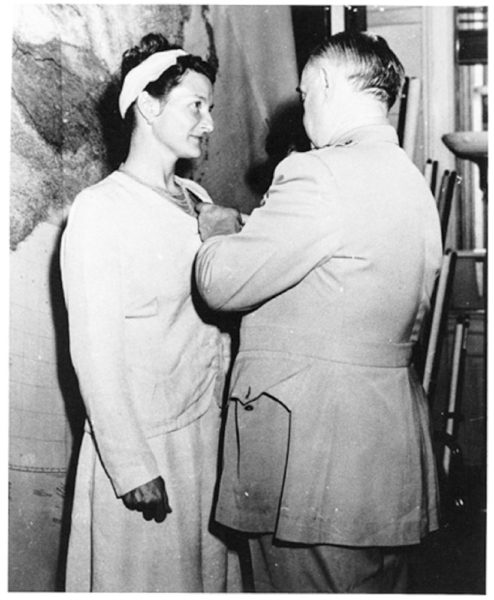Virginia Hall receiving the Distinguished Service Cross from General Donovan. Photo by anonymous (September 1945). PD-U.S. Government. Wikimedia Commons. 
