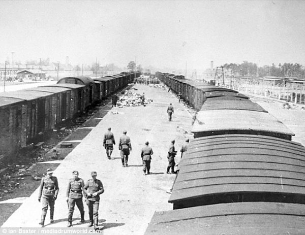 After the deportees have disembarked at Auschwitz and the sorting process has finished. Crematoria II and III can be seen in the far background. Photo by anonymous (c. May 1944). ©️Ian Baxter/mediadrumworld.com.